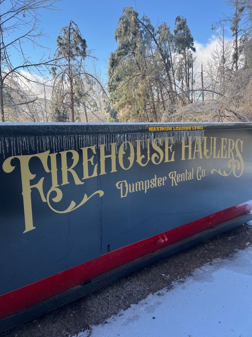 Ice covered firehouse haulers dumpster in Oxford, MS.